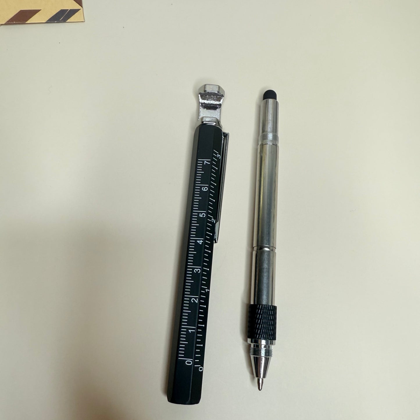Pen and ruler on a light surface
