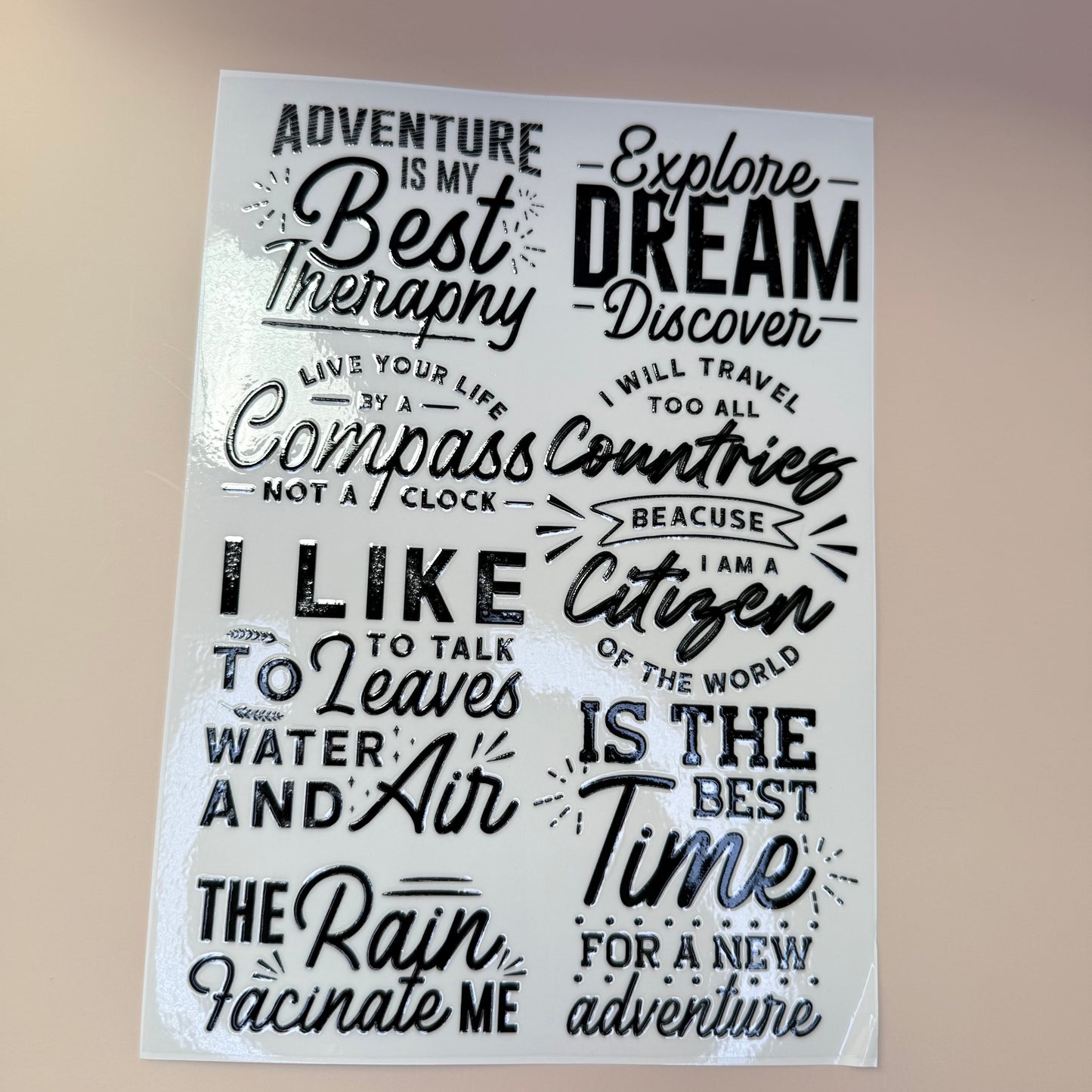 Sheet of motivational quotes on a beige background