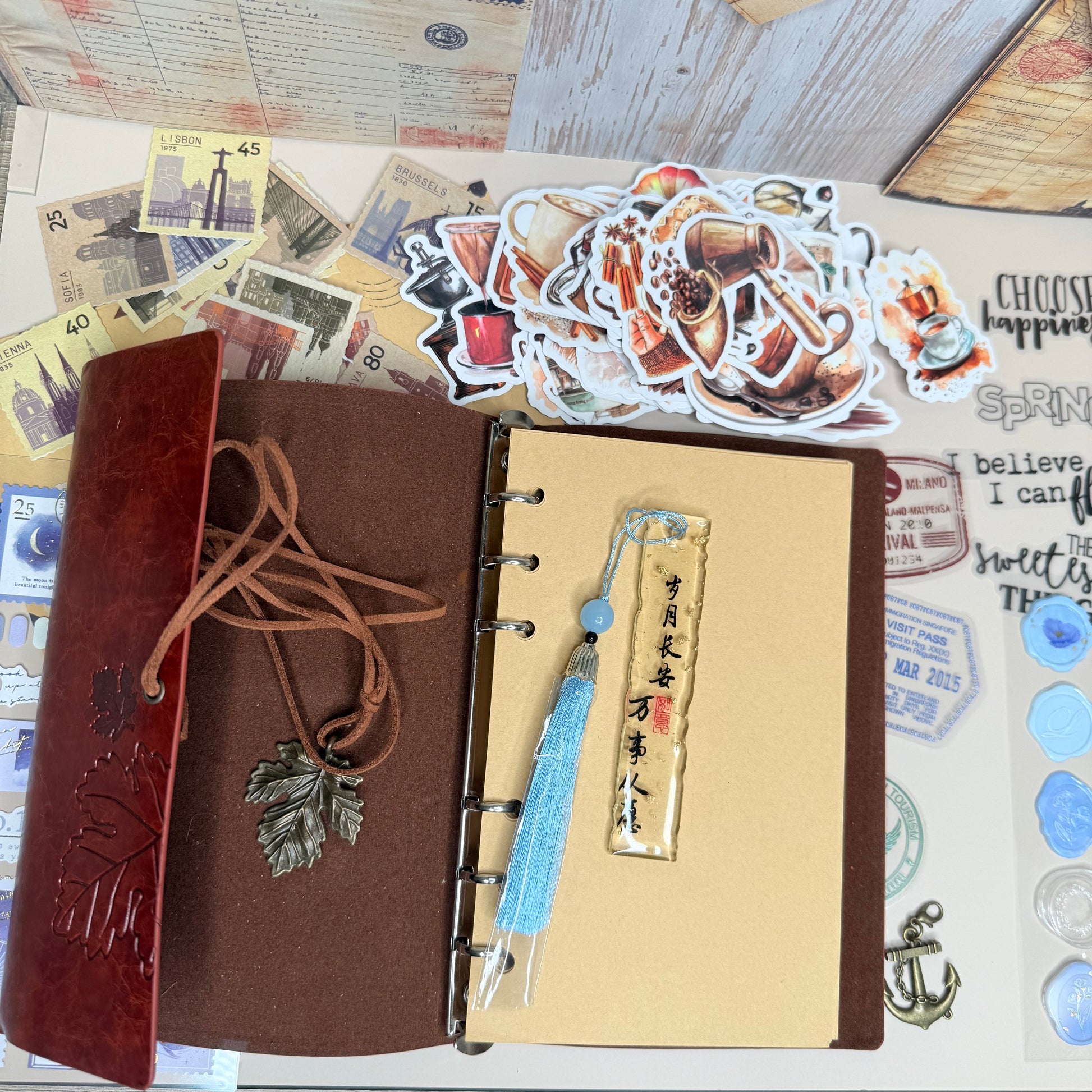Brown leather notebook with decorative elements on a textured surface