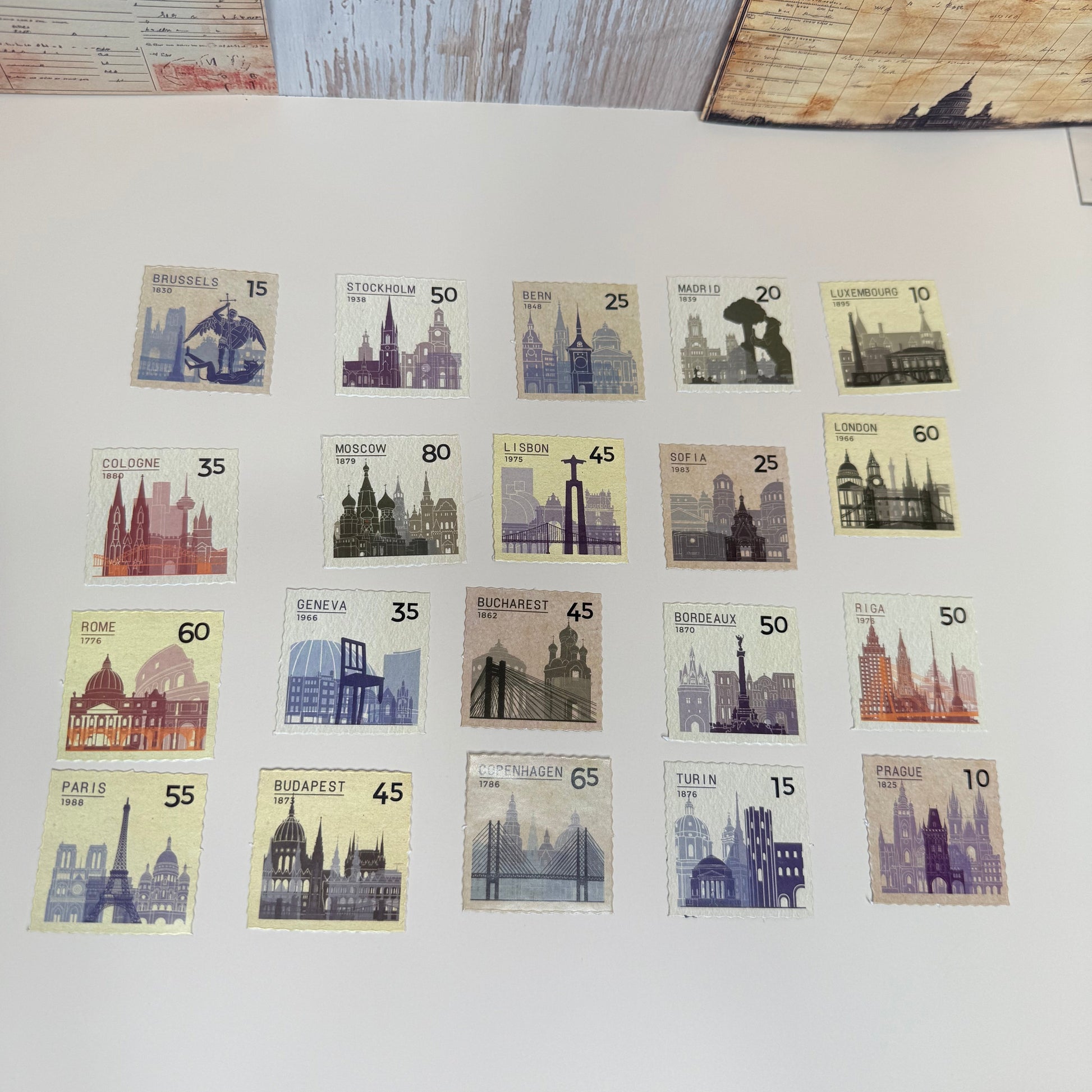 Collection of vintage stamps on a display page with a wooden surface.
