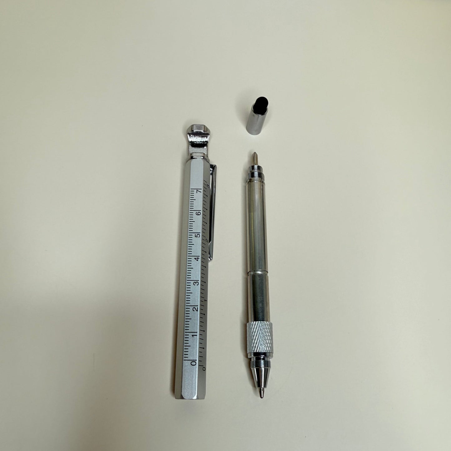 Pen and ruler on a light surface