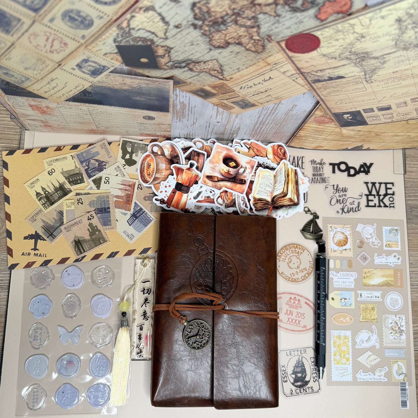 Brown leather travel journal with decorative elements on a wooden surface