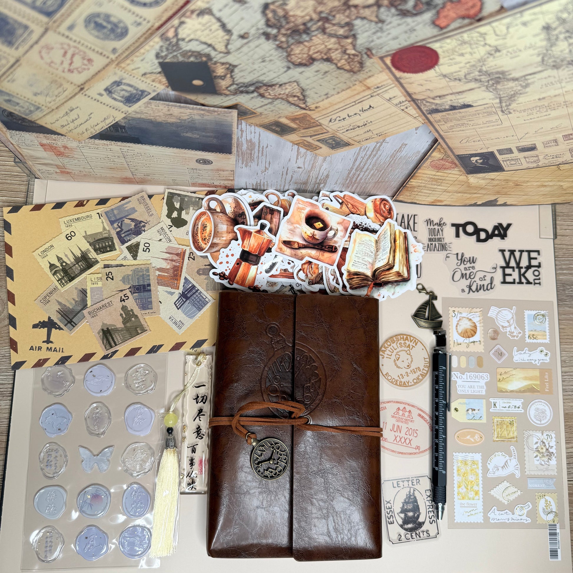 Brown leather travel journal with decorative elements on a wooden surface