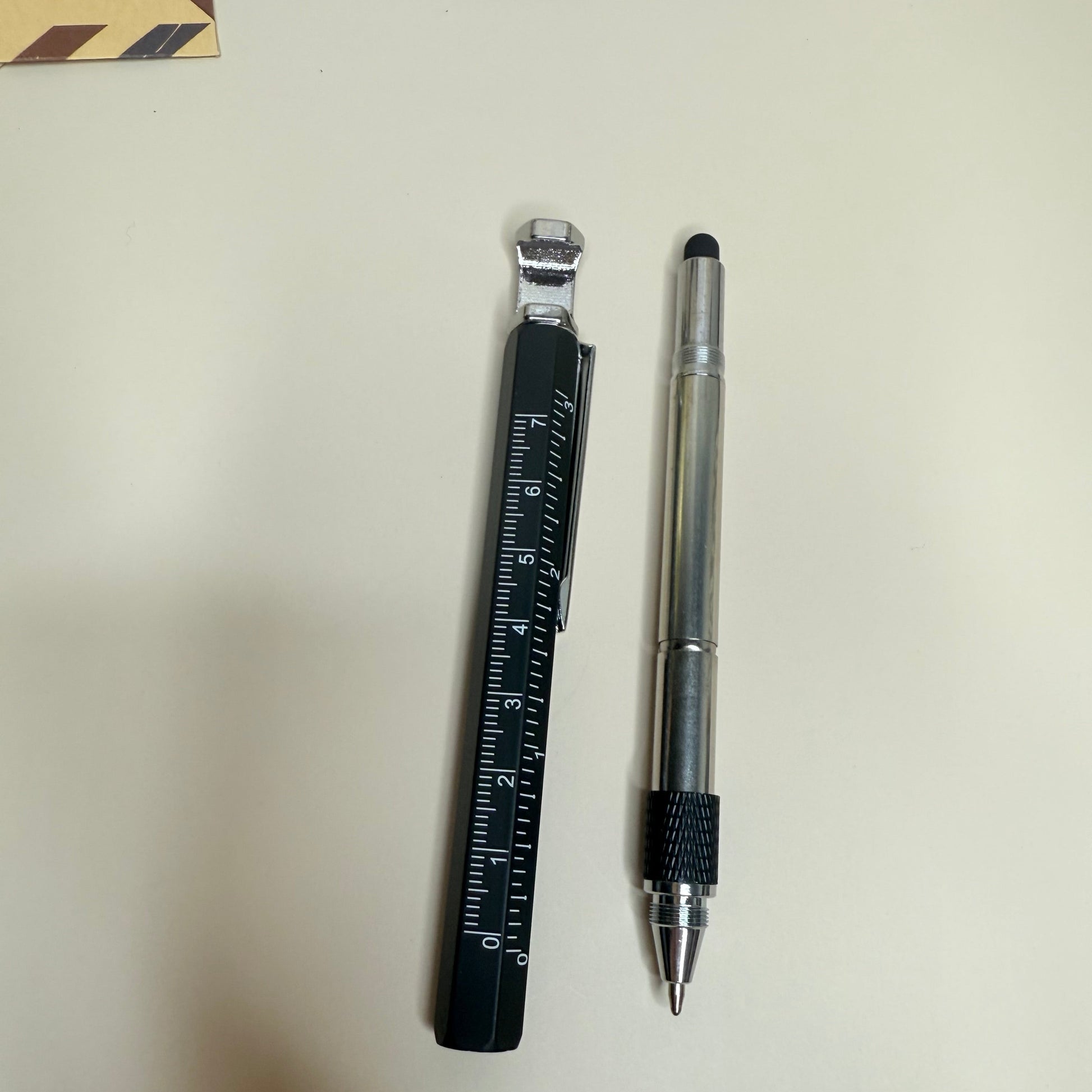 Pen and ruler on a light surface