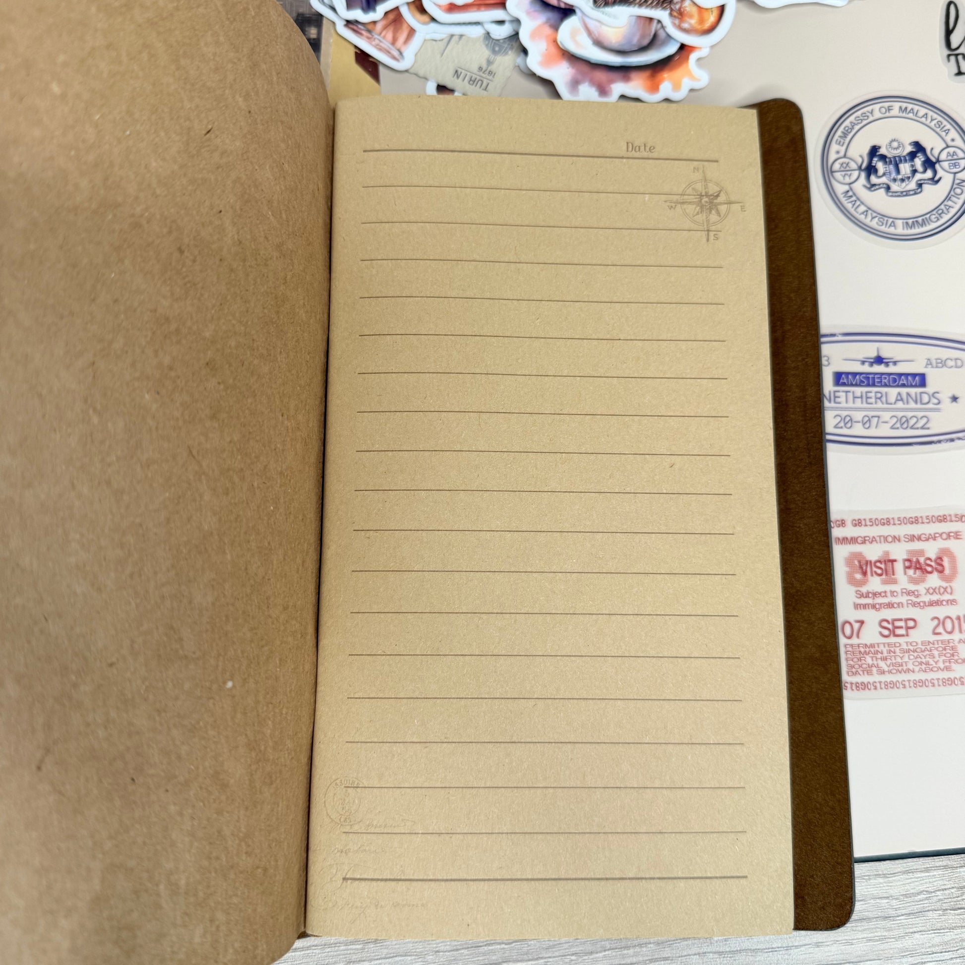 Brown notebook on a textured surface with decorative elements