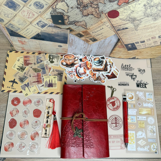 Collection of vintage-style stationery items on a wooden surface