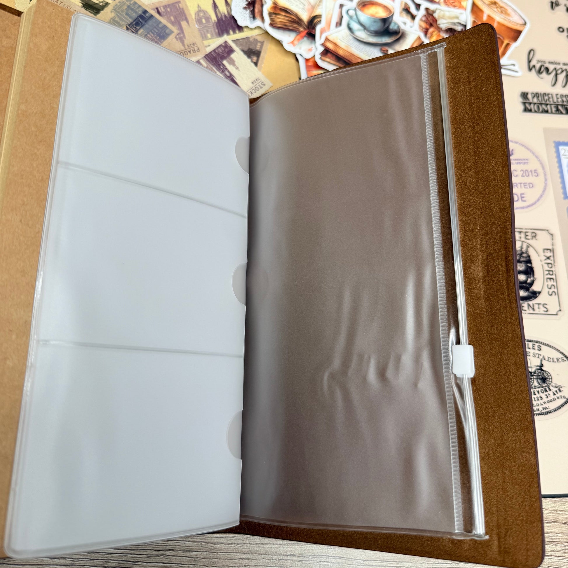 Open leather-bound album with a wooden frame on a textured surface