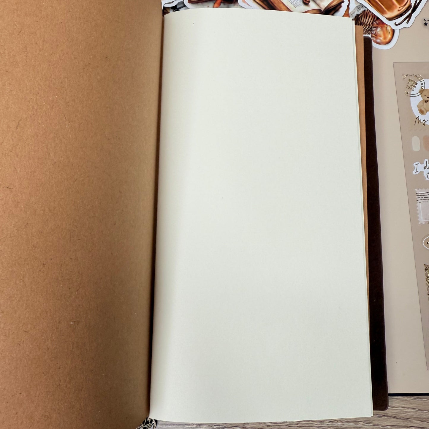 Roll of paper on a surface with a decorative border in the background