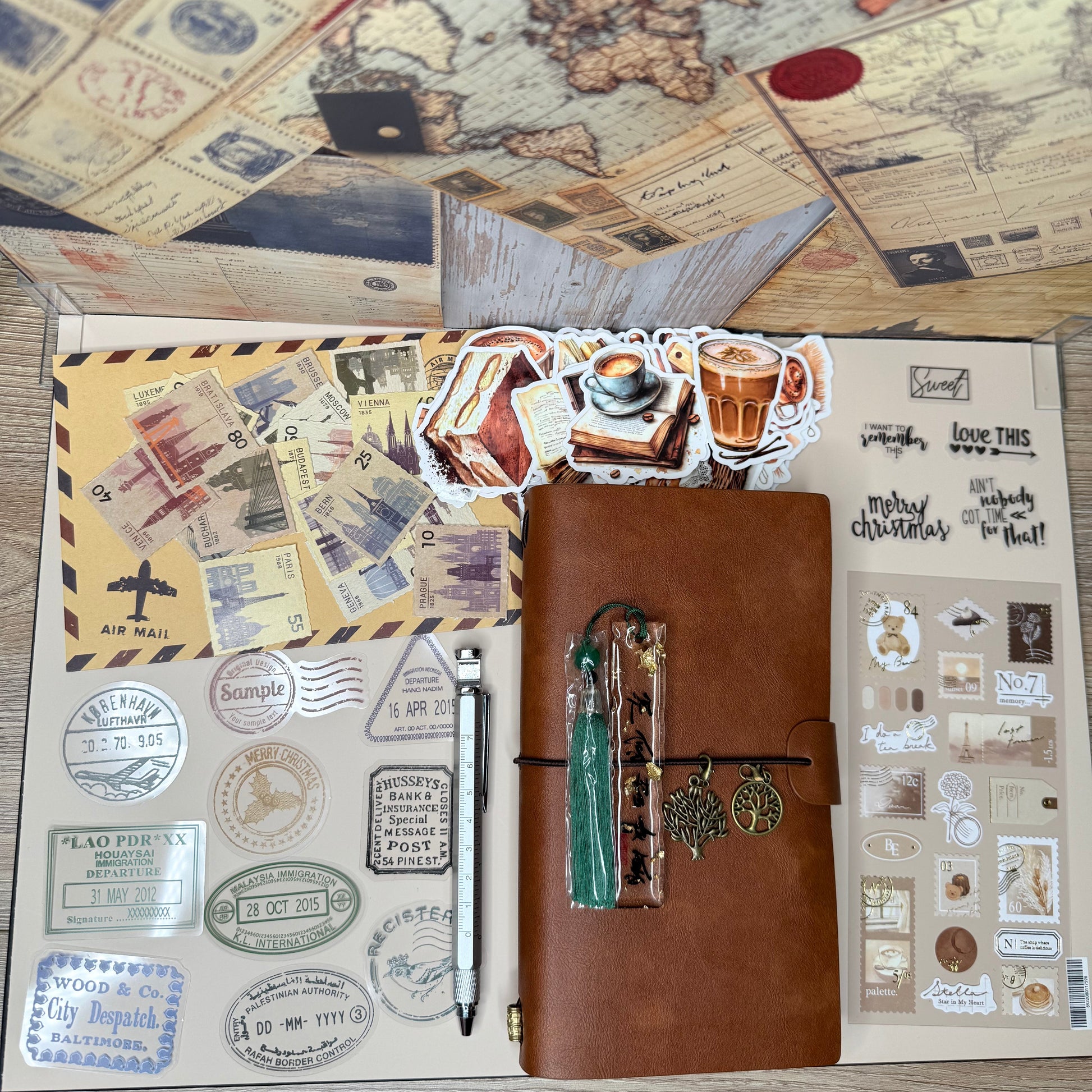 Brown leather travel journal with stamps and a pen on a wooden surface