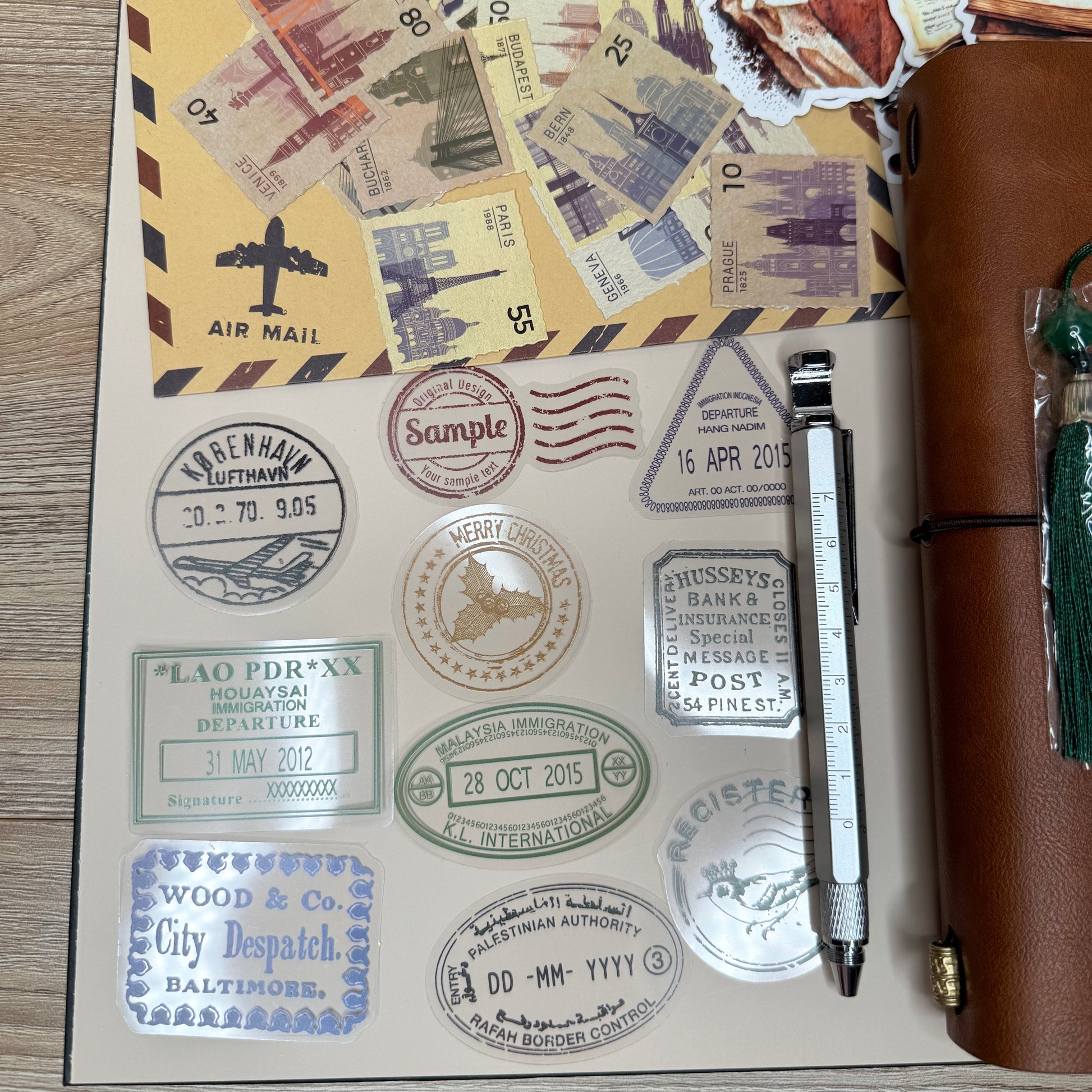 Stamps and a pen on a wooden surface