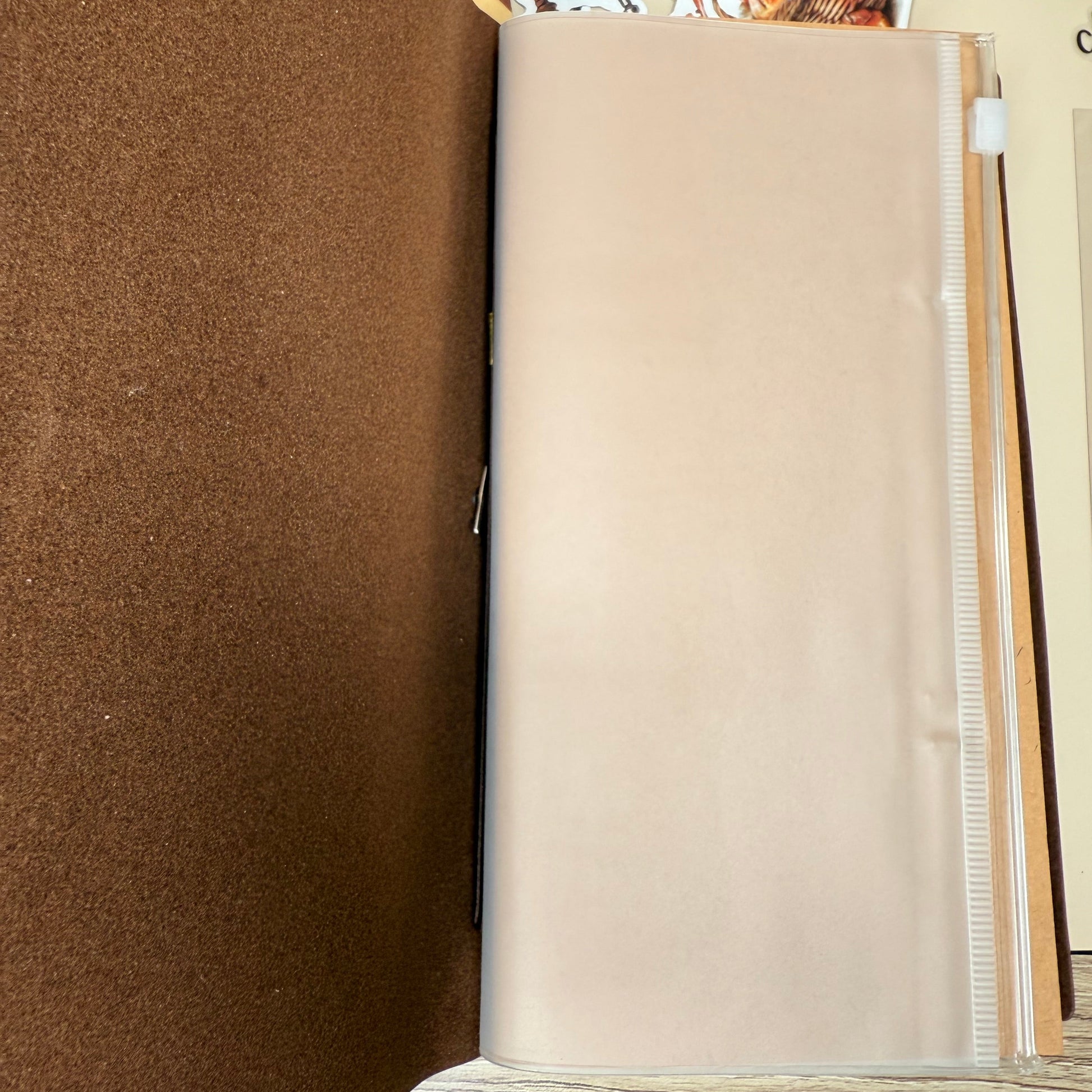 Brown fabric on a table with a beige roll of paper towels in the background.