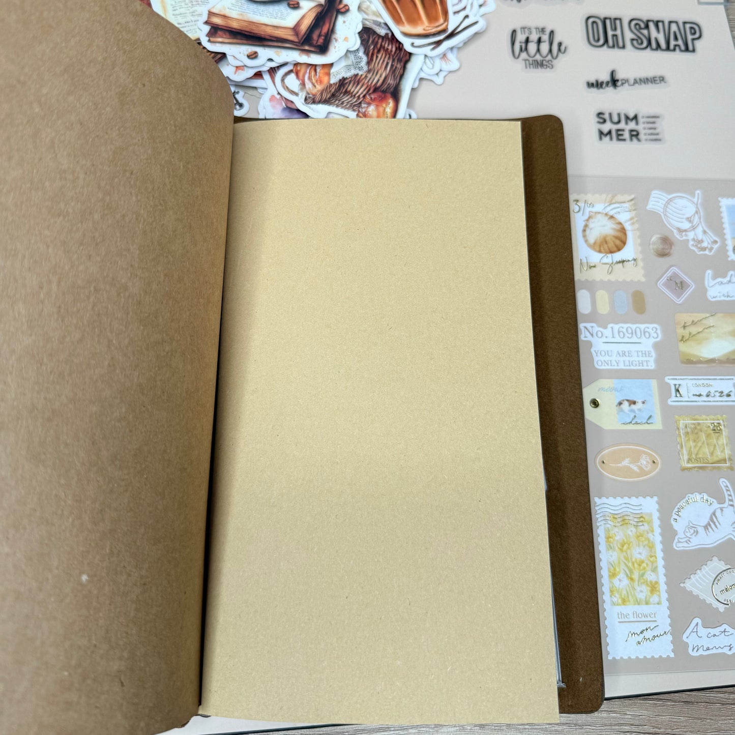 Open cardboard box with decorative paper on a wooden surface