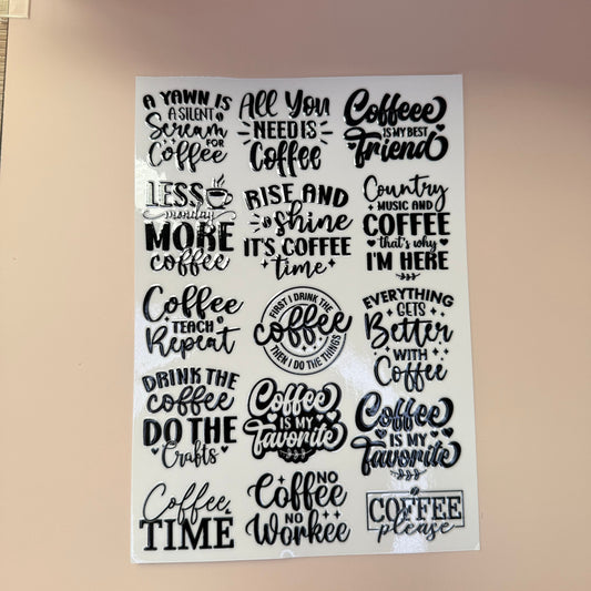 Sheet of coffee-themed stickers with various sayings on a beige background