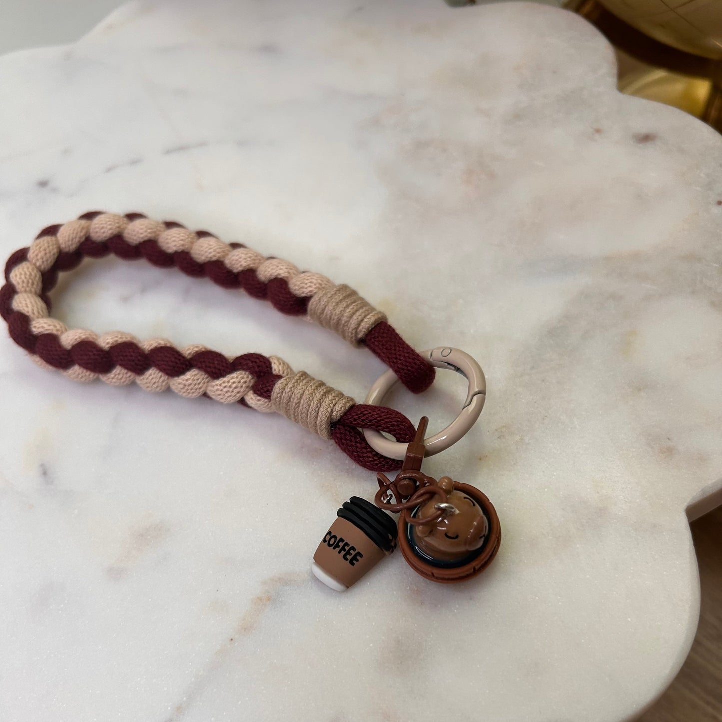 Keychain with braided design on a marble surface
